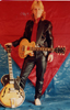 With Gibsons and sparkly black jacket 